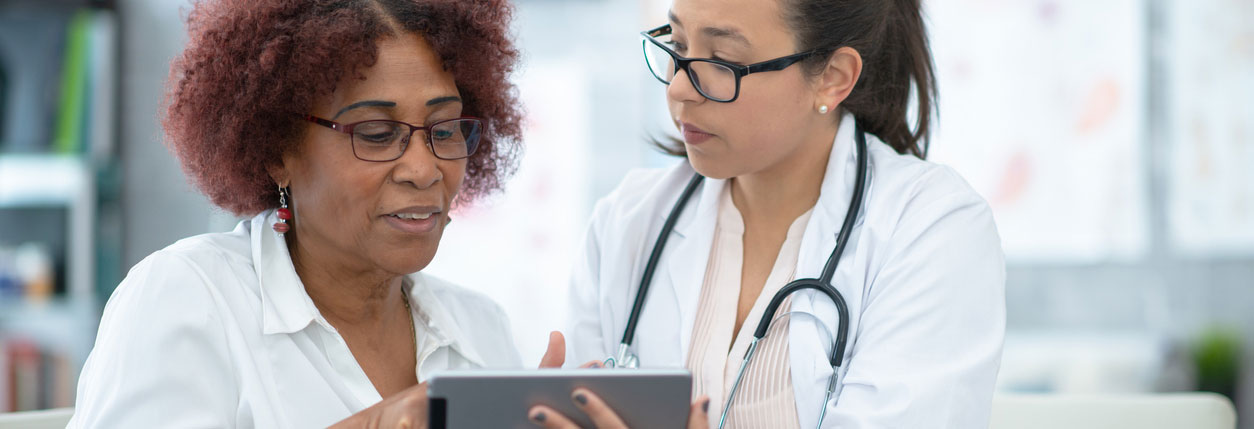 A Baptist Memorial Hospital physician discusses options for ICU medical care with a patient.