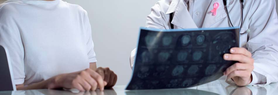 A doctor at Baptist’s breast health center meets with a patient